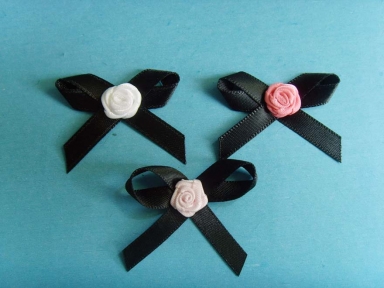 Black satin ribbon bows with colourful rose bows